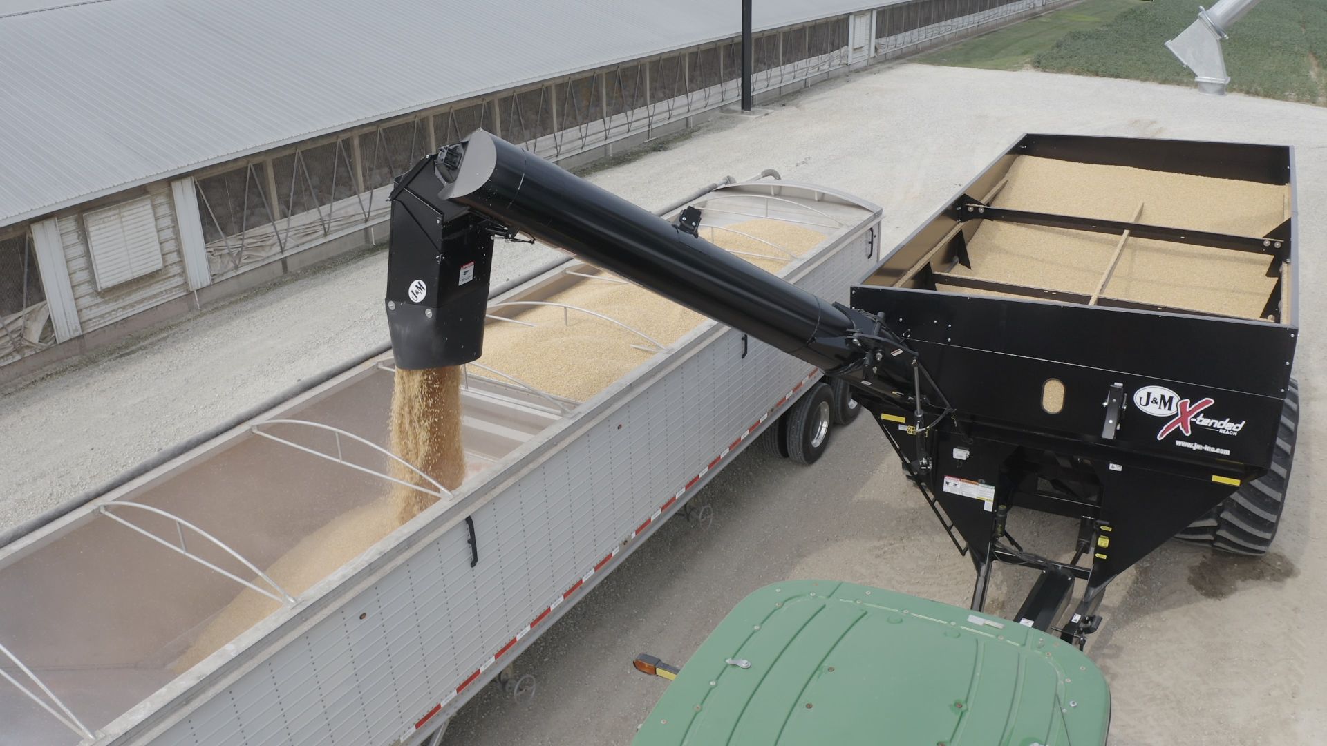 Overhead view of the J&M Right Hand Grain Cart unloading into a semi trailer. 